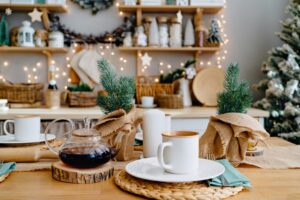 a cup of tea on the table in decorated kitchen for new year. Christmas decor.