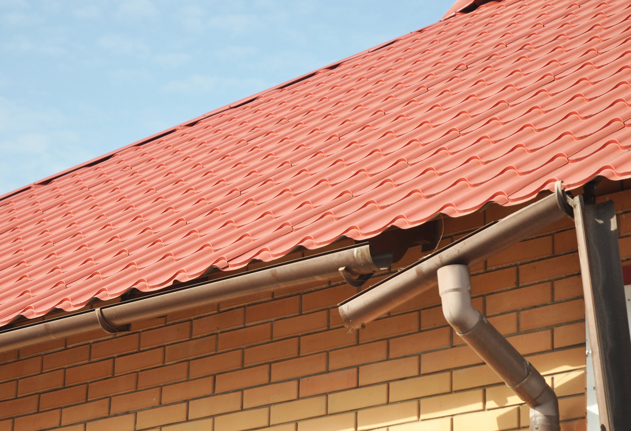 a property with bad, broken guttering falling off the roof