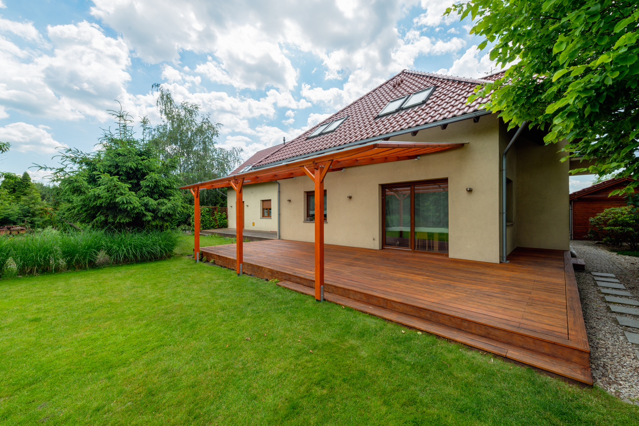 a small property built on a plot of land in a garden
